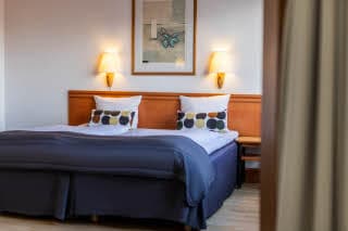 sänky junior suite sviitissä huone scandic aarhus vest hotelli aarhus tanska