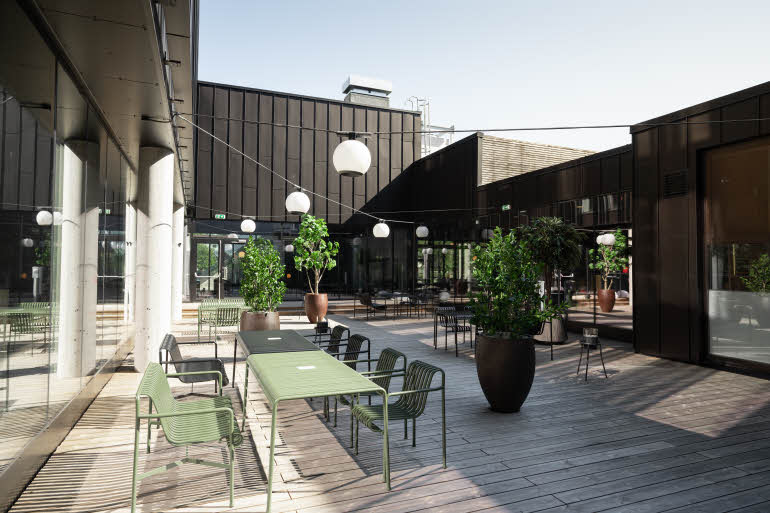 Atrium with chairs and table at Scandic Hamar