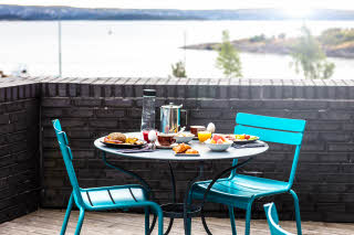 Outdoor breakfast table with beautiful sea view