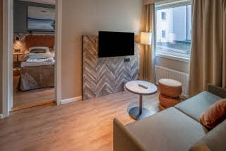 sofabed and tv in family room at scandic harstad
