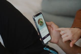 hands with a mobile phone at scandic go