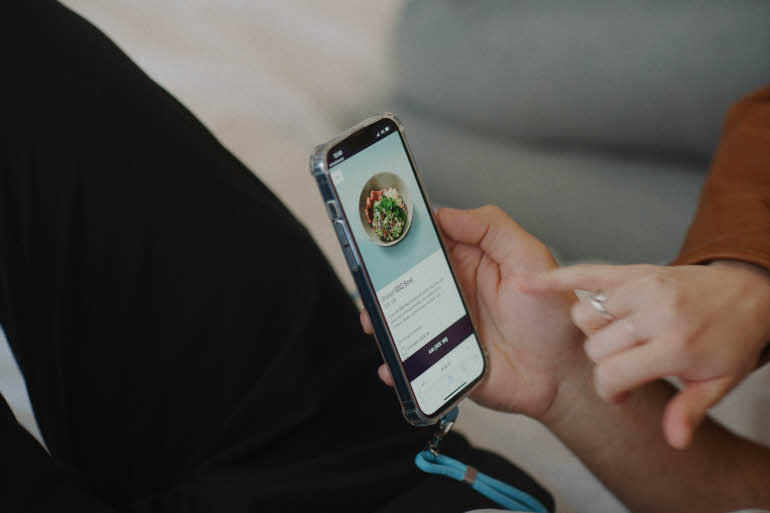hands with a mobile phone at scandic go
