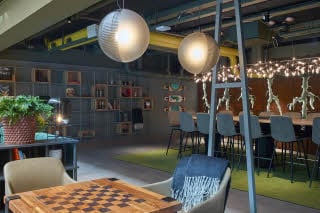 Seating area in cafe at Downtown Camper by Scandic