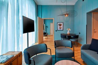 seating area in master suite at scandic göteborg central