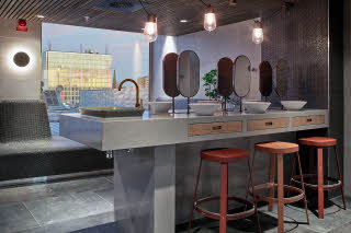 The Nest, spa, sink and chairs Downtown Camper by Scandic