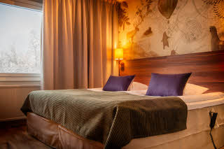 Bed in a Standard Twin accessibility room at Scandic Luleå