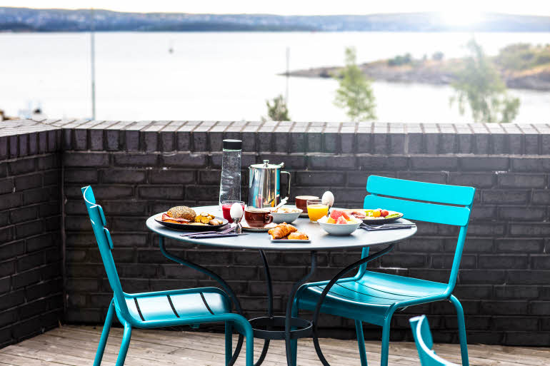 Outdoor breakfast table with beautiful sea view